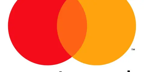 Logo de Mastercard España con sus dos círculos superpuestos, rojo y naranja, y el nombre de la marca.
